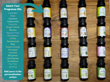 Load image into Gallery viewer, Row of essential natural plant extract oil bottles with labels on a wooden surface, with a list of all the different types of fragrance oils.