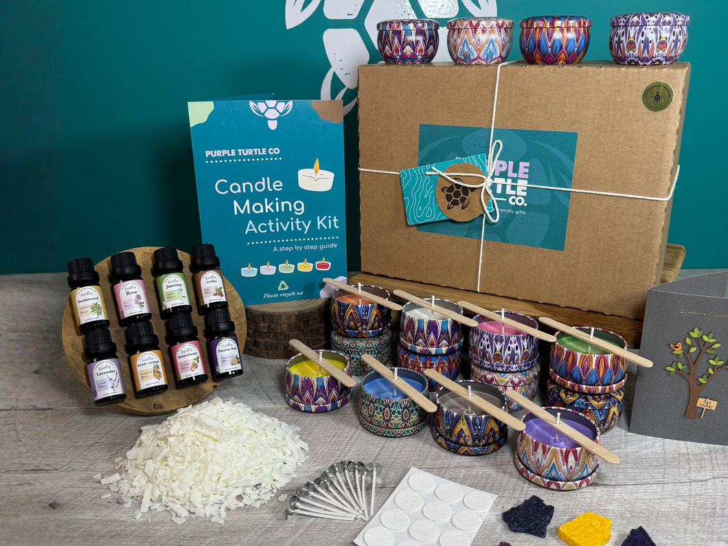 Purple Turtle Co. Candle Making Activity Kit with materials on a wooden surface against a teal wall.
